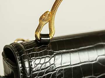 a close up of a black purse