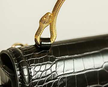 a close up of a black purse