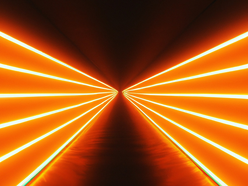 a long corridor with orange lights