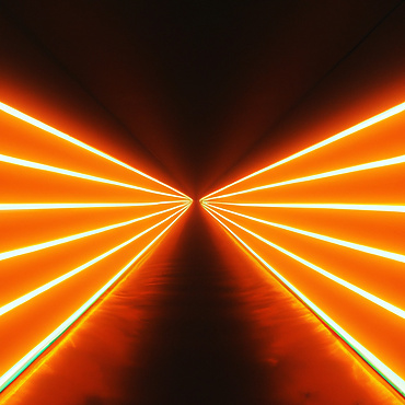 a long corridor with orange lights