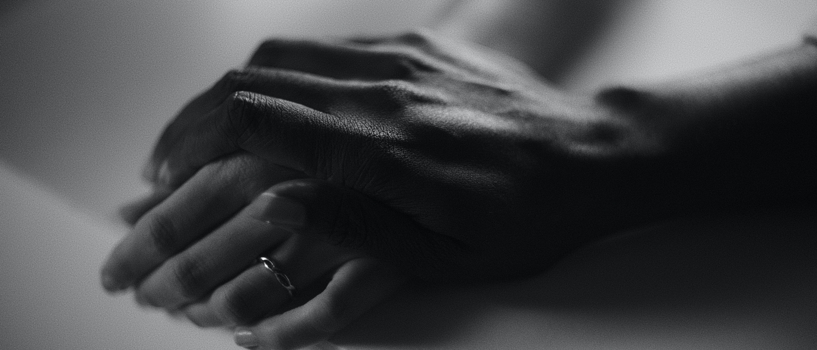a close up of a hands folded together