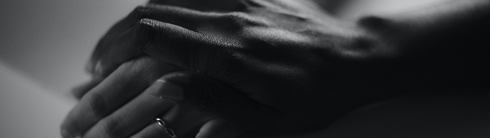 a close up of a hands folded together