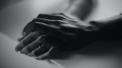 a close up of a hands folded together