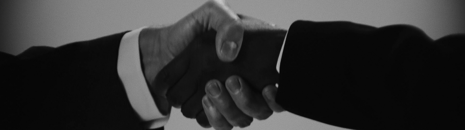 a close-up of hands shaking