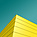 a yellow building with blue sky