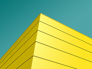 a yellow building with blue sky
