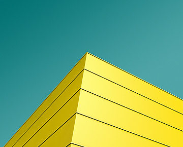 a yellow building with blue sky