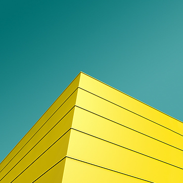 a yellow building with blue sky