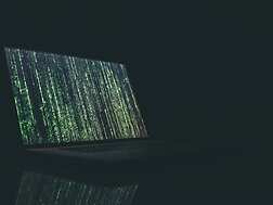 a laptop with green and blue lines on it