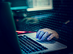 a person typing on a laptop