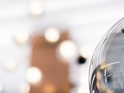 close up of glass bowl with lights in background