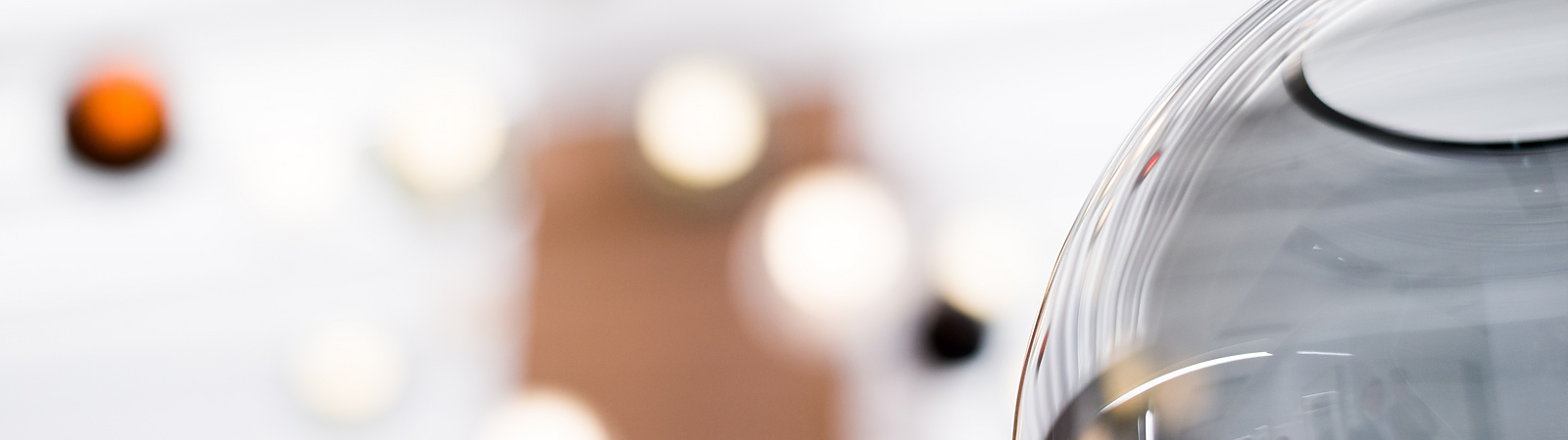close up of glass bowl with lights in background