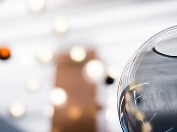 close up of glass bowl with lights in background