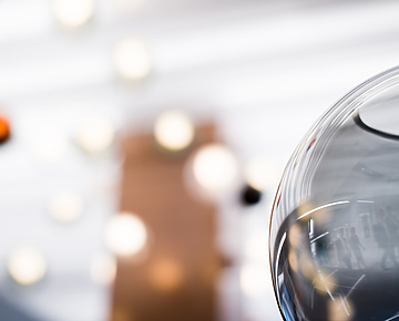 close up of glass bowl with lights in background