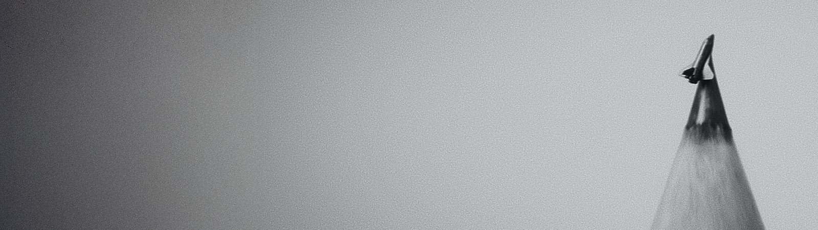 a pencil with a small graphite carving of a rocket