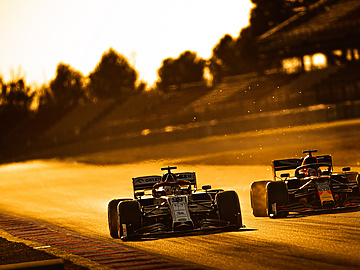 two F1 cars racing