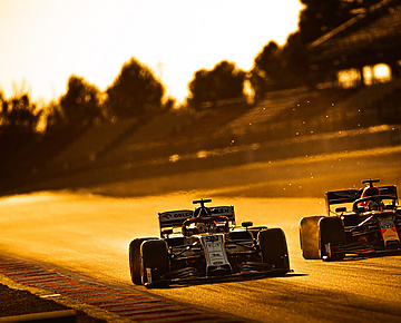 two F1 cars racing
