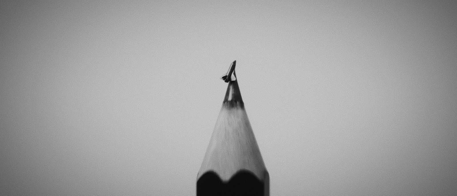 pencil with a rocket carved on top