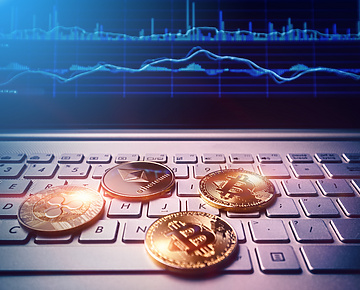 Bitcoins placed over laptop