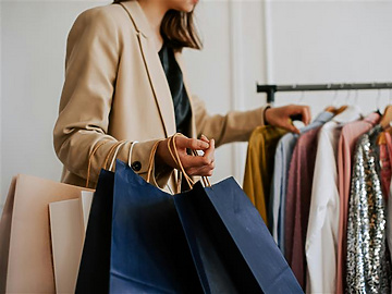 Woman shopping in fashion store