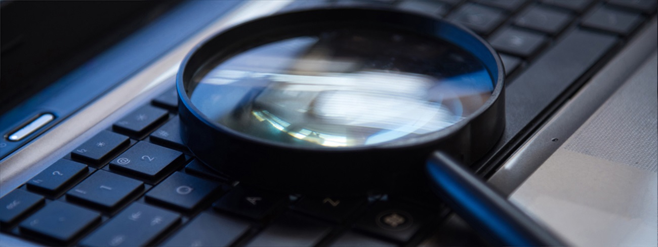 magnifying glass on laptop