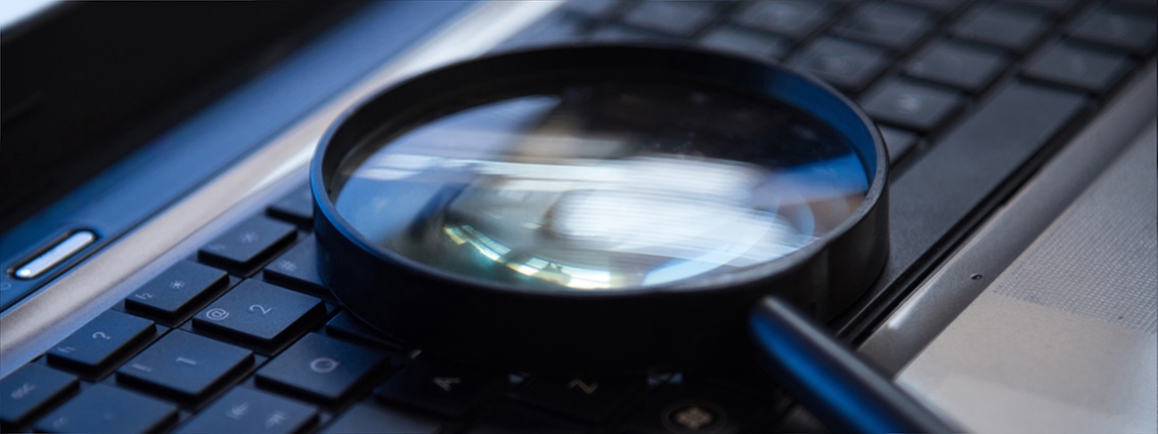 magnifying glass on laptop