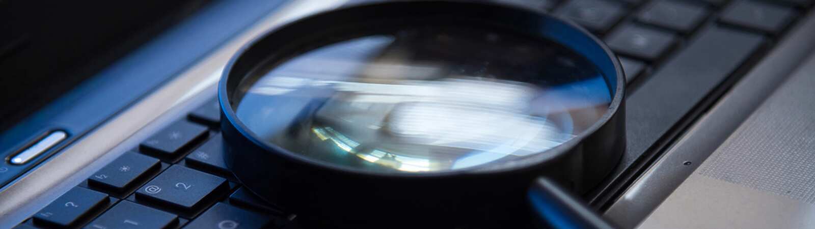 magnifying glass on laptop