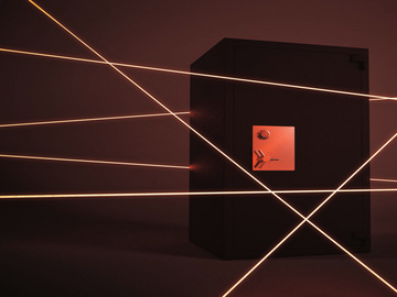 a black safe with red lights around it