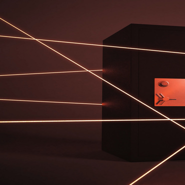 a black safe with red lights around it