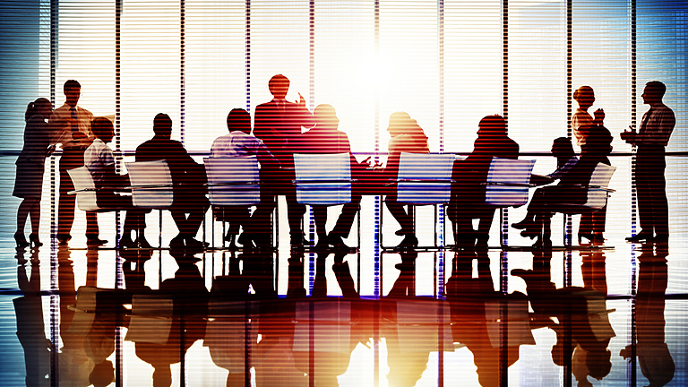 People in a meeting room at work