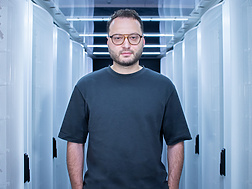 a person standing in a room with white walls