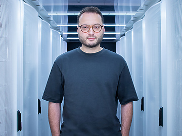 a person standing in a room with white walls