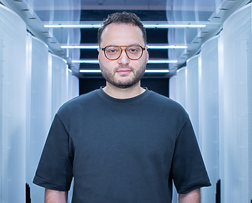 a person standing in a room with white walls