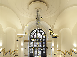 a hallway with a large window and stairs