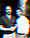 Two men standing together in a narrow alleyway