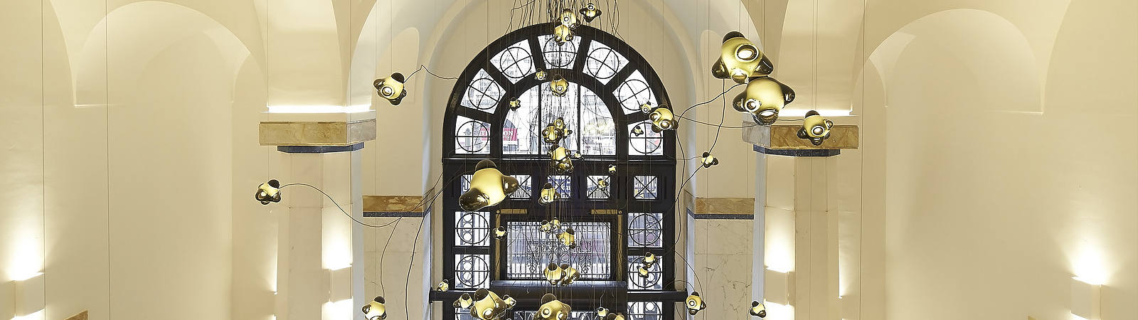 a hallway with a large window and stairs