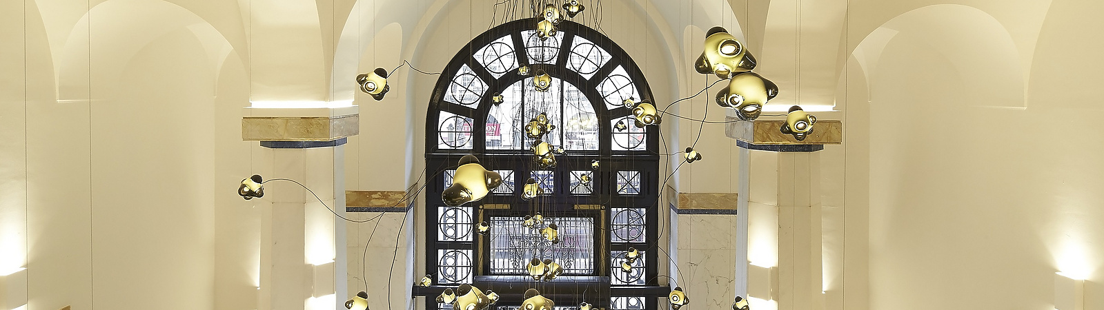 a hallway with a large window and stairs