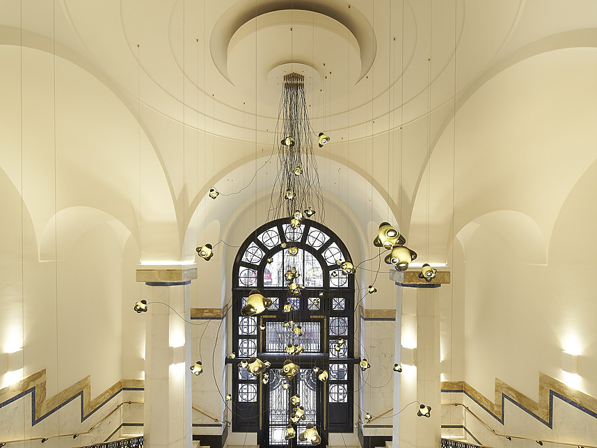 a hallway with a large window and stairs