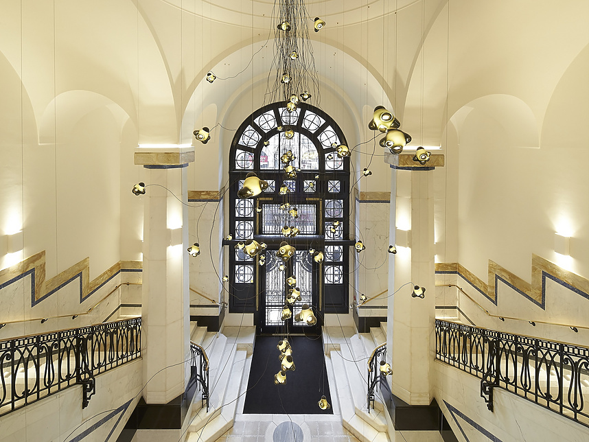 a hallway with a large window and stairs