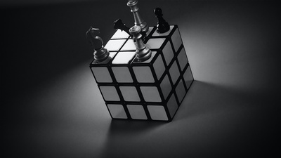 a puzzle cube with chess pieces