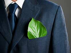 a person in a suit with a leaf in his pocket