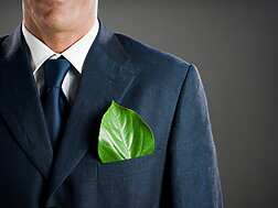 a person in a suit with a leaf in his pocket