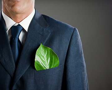 a person in a suit with a leaf in his pocket