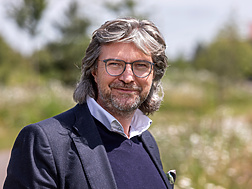 a person with glasses and a beard