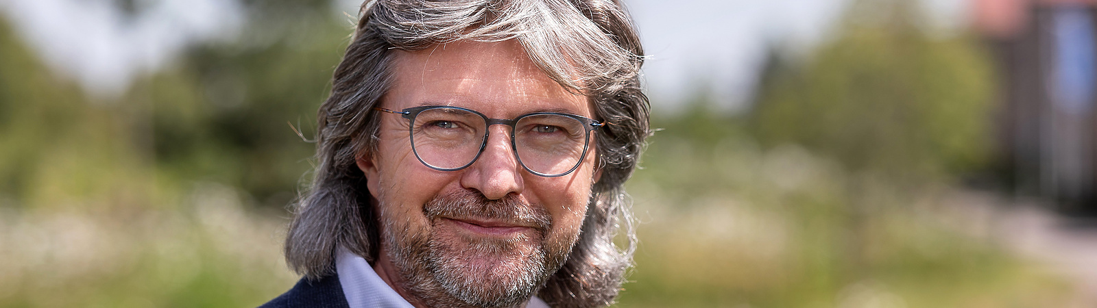 a person with glasses and a beard