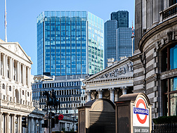 a building with columns and a statue in front of it