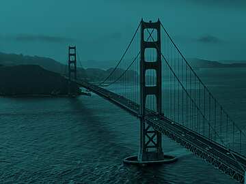a bridge over water with cars on it