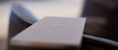 Brochure with the word 'Private' on it resting on a chair