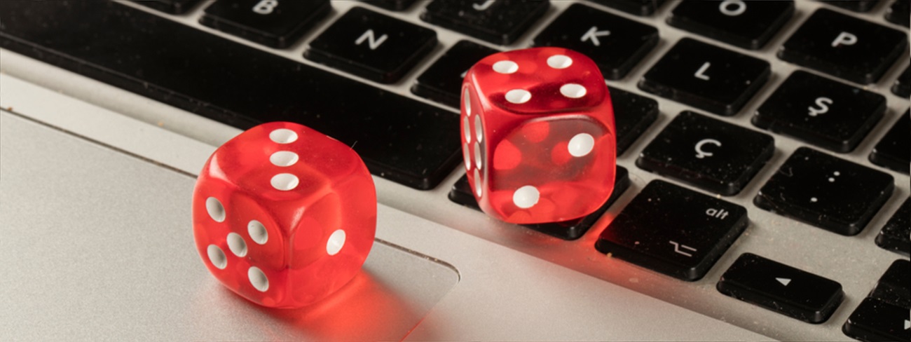games dice sitting on laptop