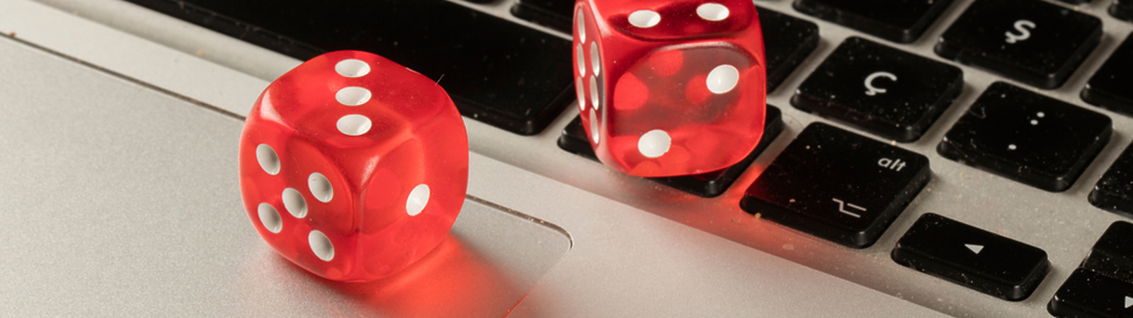 games dice sitting on laptop